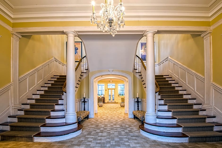 This image shows a double Grand stair cases at the entrance of the Vanderbilt hotel